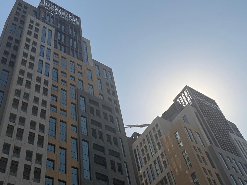 High-rise towers with steel spire structures