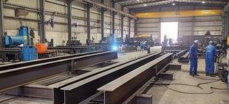 Heavy steel beams in the fabrication workshop