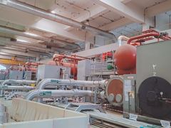 Chiller units and insulated piping in the plant hall